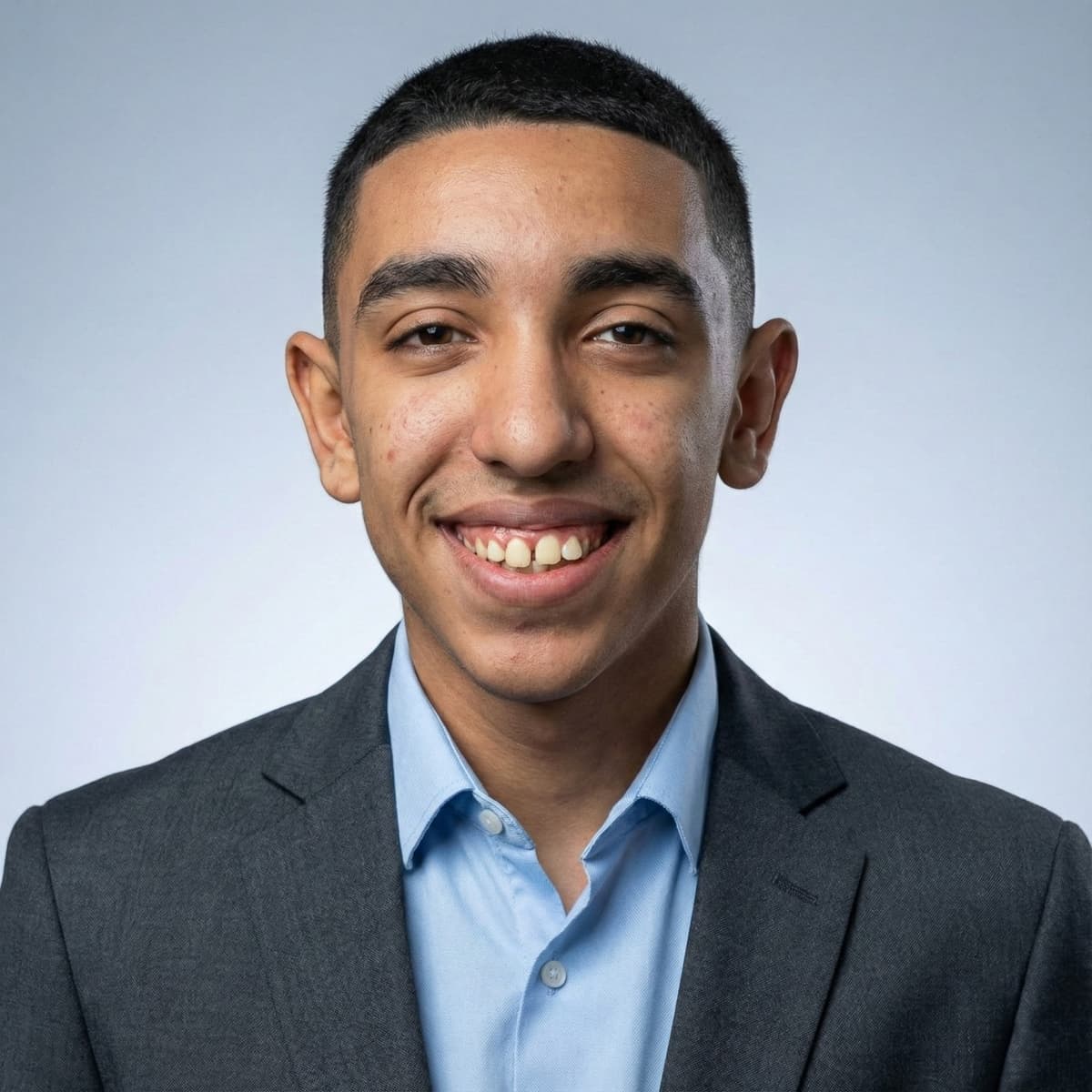 Headshot of Ebraheem facing a camera
